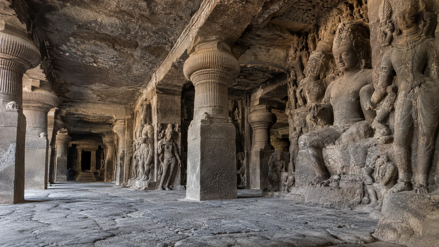Rock-cut columns and sculptures inside Elephanta Caves